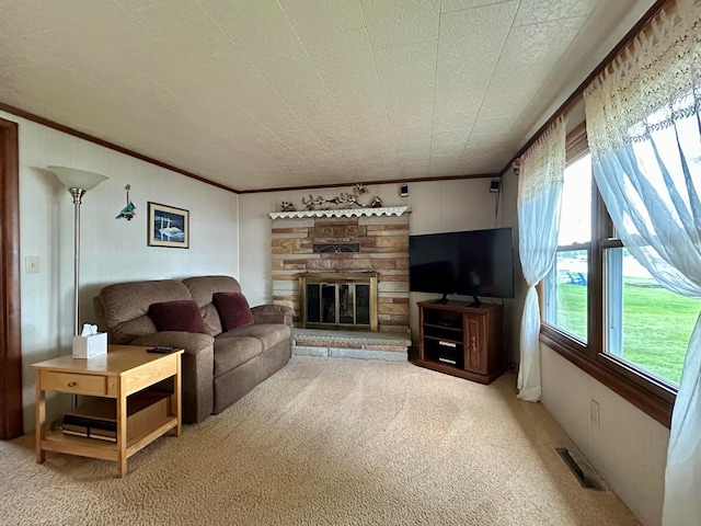 living room with light colored carpet, a fireplace, and crown molding