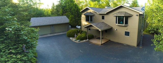 view of front of property with an outbuilding