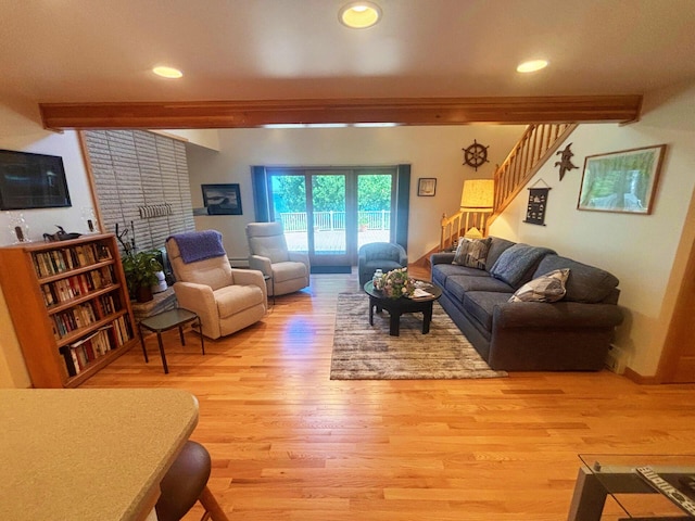 living room with light wood-style floors, stairs, beam ceiling, and recessed lighting