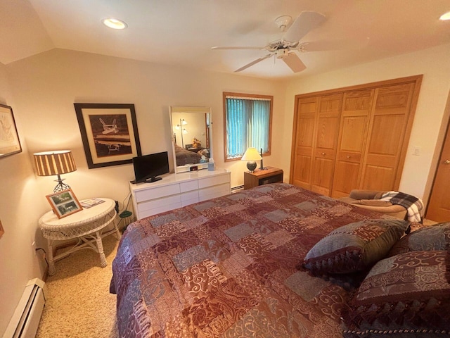 bedroom with a ceiling fan, a baseboard radiator, vaulted ceiling, a closet, and recessed lighting