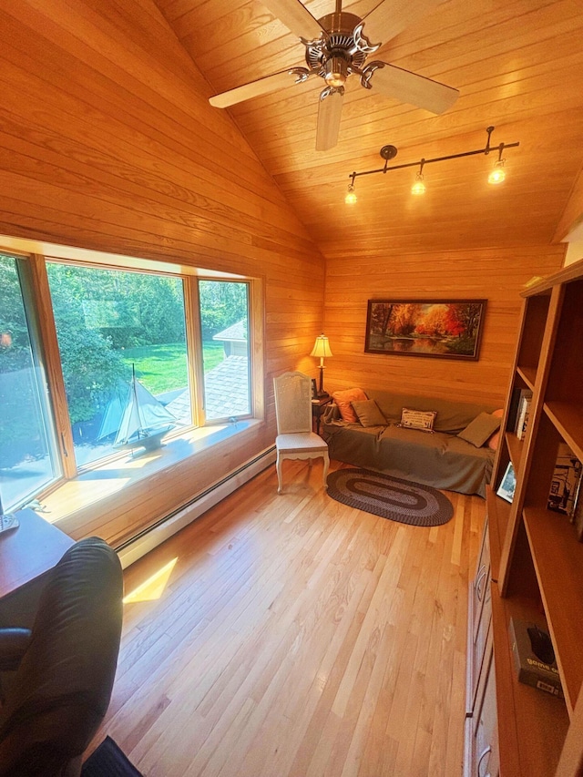 living room featuring wooden walls, wooden ceiling, wood finished floors, vaulted ceiling, and baseboard heating