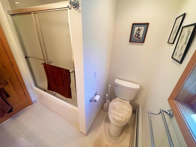 bathroom with combined bath / shower with glass door, toilet, and tile patterned floors