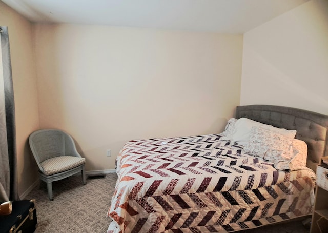 bedroom featuring light colored carpet