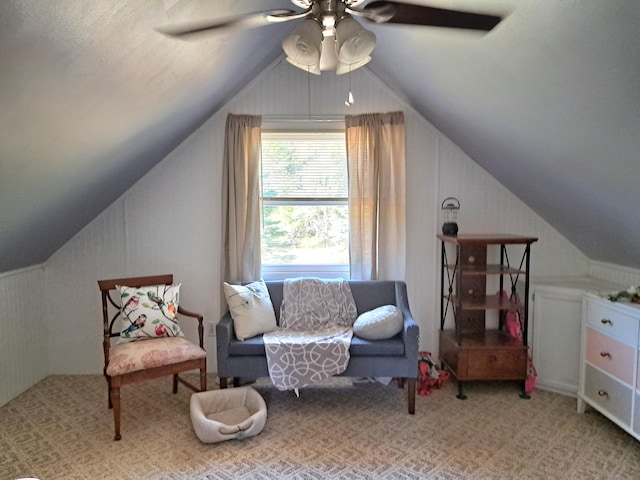 sitting room featuring ceiling fan, a textured ceiling, and lofted ceiling