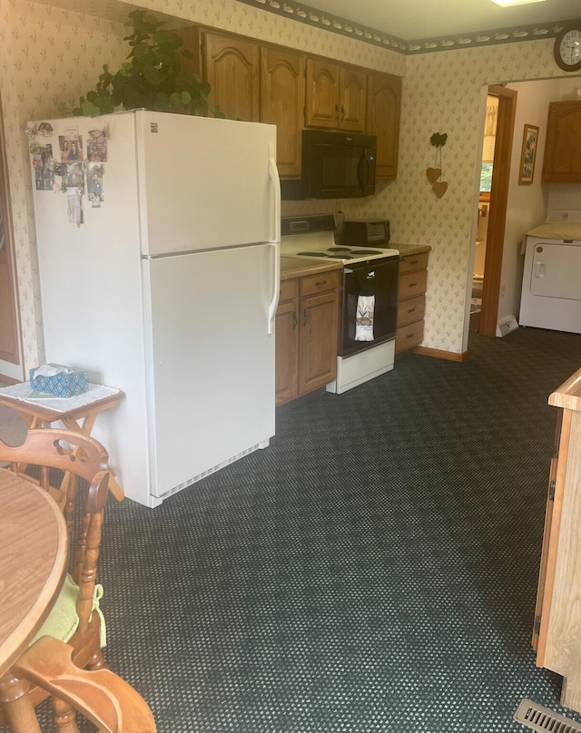 kitchen with washer / dryer, carpet flooring, and white appliances