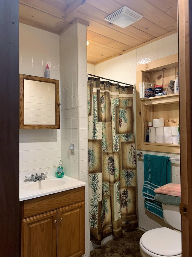 bathroom featuring tile walls, wooden ceiling, vanity, and toilet