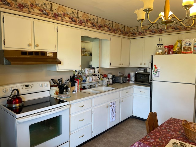 kitchen with premium range hood, a chandelier, sink, dark tile patterned floors, and white appliances