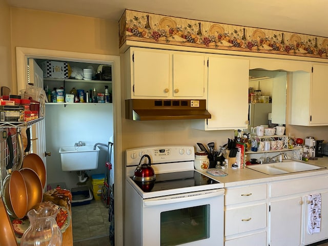 kitchen featuring premium range hood, tile patterned floors, white cabinets, sink, and white range with electric cooktop