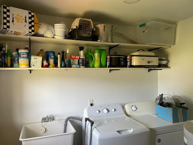 laundry room featuring independent washer and dryer and sink