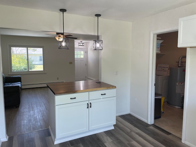 kitchen with ceiling fan, baseboard heating, dark hardwood / wood-style flooring, white cabinetry, and water heater