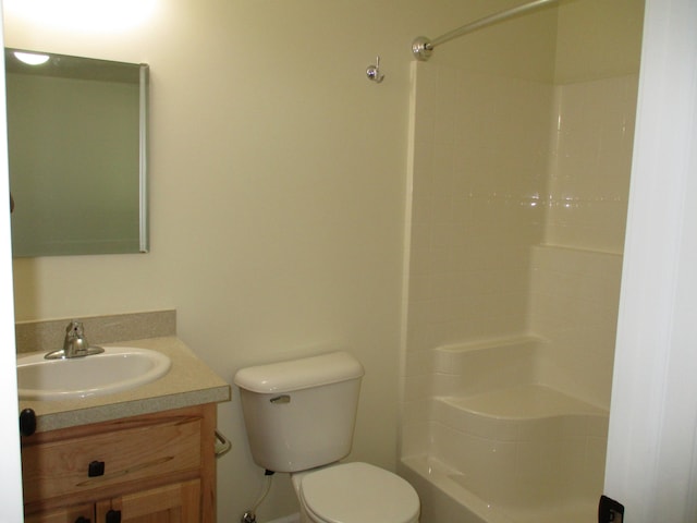 full bathroom with washtub / shower combination, vanity, and toilet