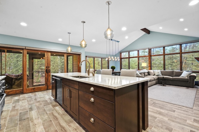 kitchen with sink, lofted ceiling with beams, hanging light fixtures, a center island with sink, and dishwasher