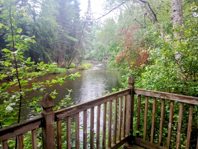 wooden terrace with a water view