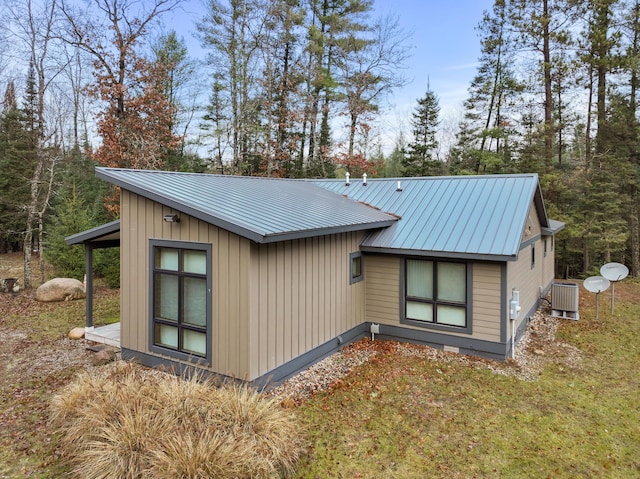 view of property exterior with central AC unit