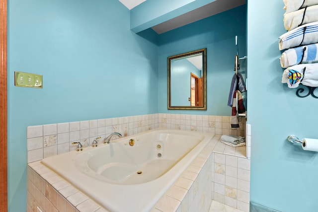 bathroom with tiled tub