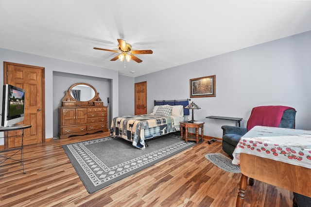 bedroom featuring ceiling fan and light wood-type flooring