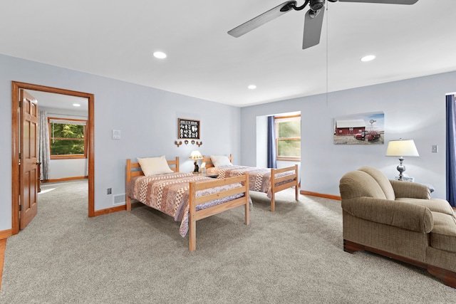 carpeted bedroom featuring ceiling fan