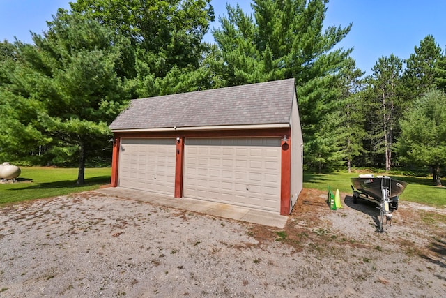 garage with a yard