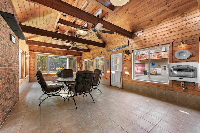 interior space featuring beam ceiling, ceiling fan, and wooden ceiling