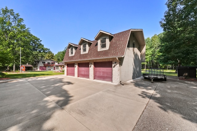 view of property exterior featuring a garage