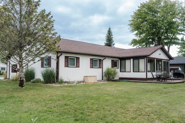 view of front of home with a patio area and a front lawn