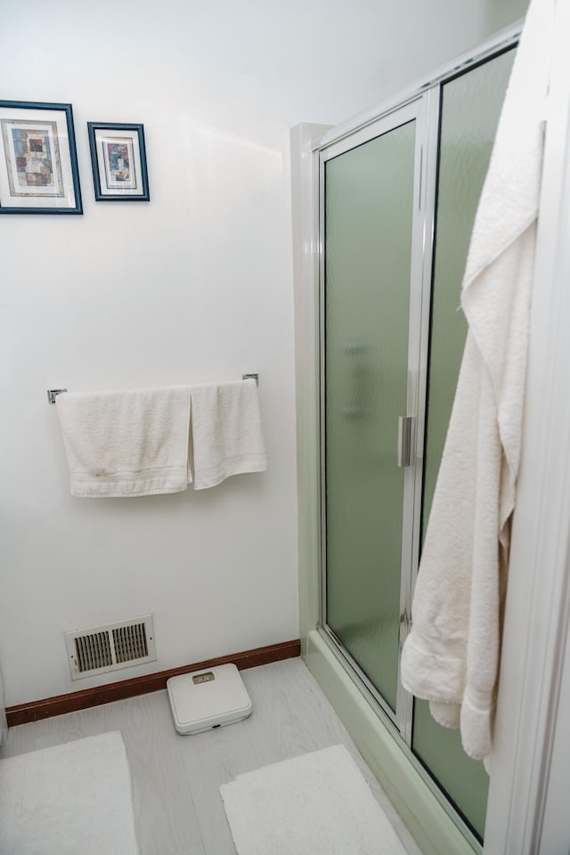 bathroom with an enclosed shower