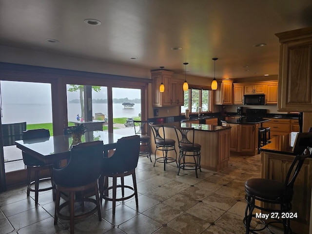 tiled dining area featuring sink