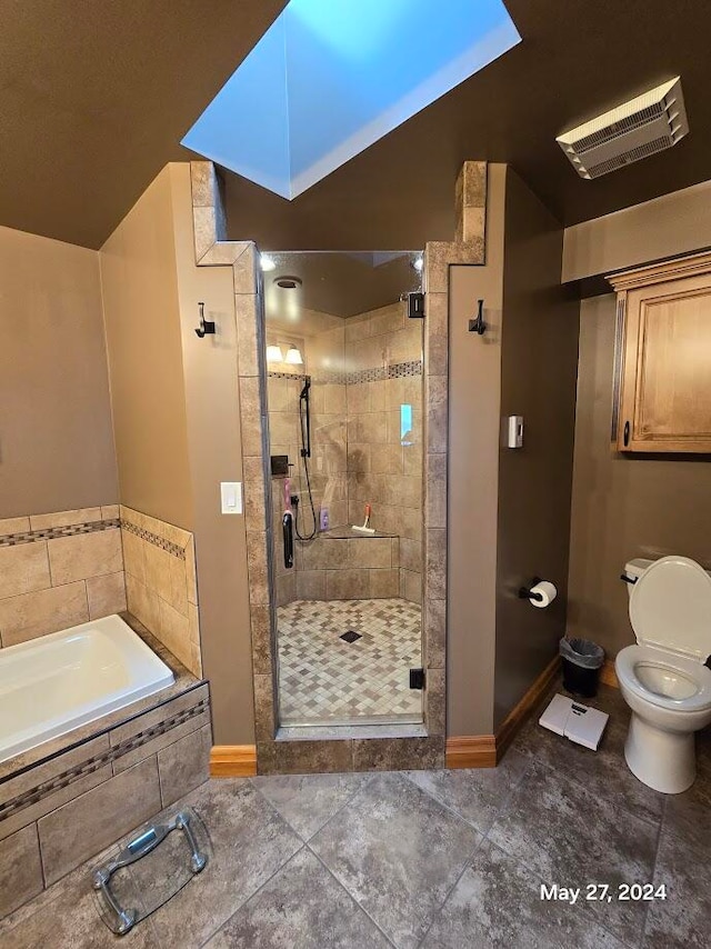 bathroom featuring toilet, independent shower and bath, and tile patterned floors