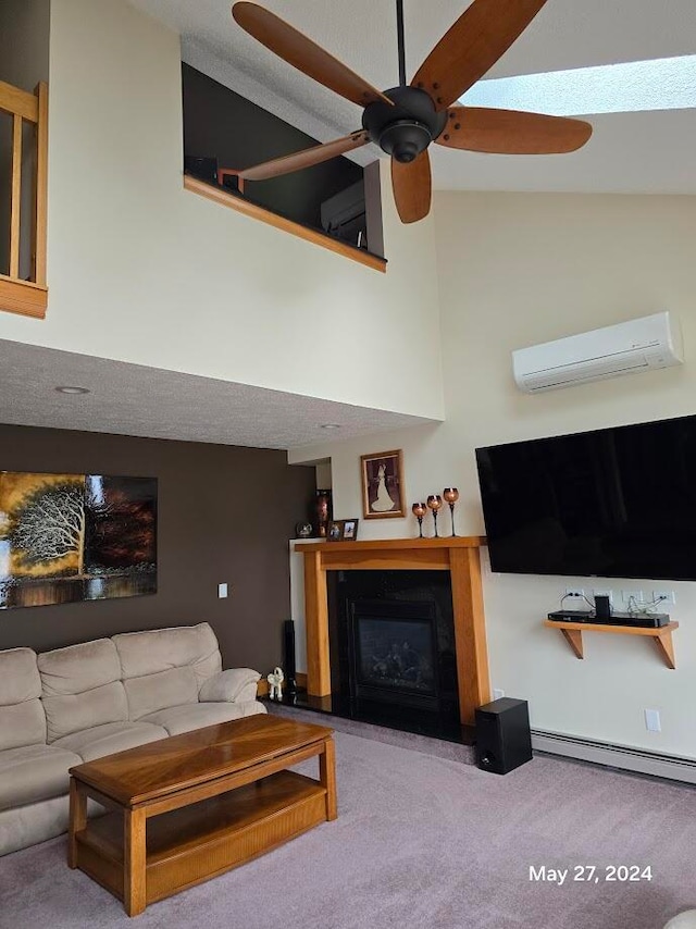 living room with ceiling fan, an AC wall unit, baseboard heating, and carpet flooring