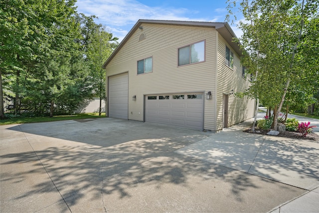 view of side of property with a garage