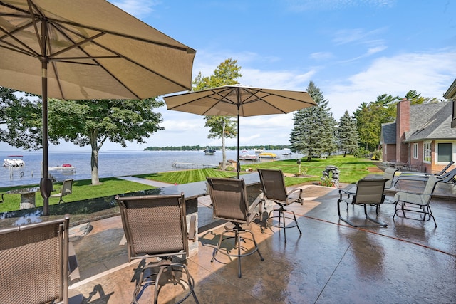 view of patio / terrace with a water view