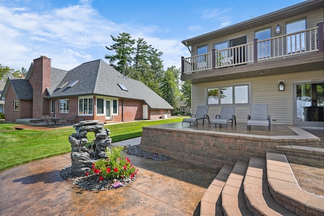 view of patio featuring a balcony