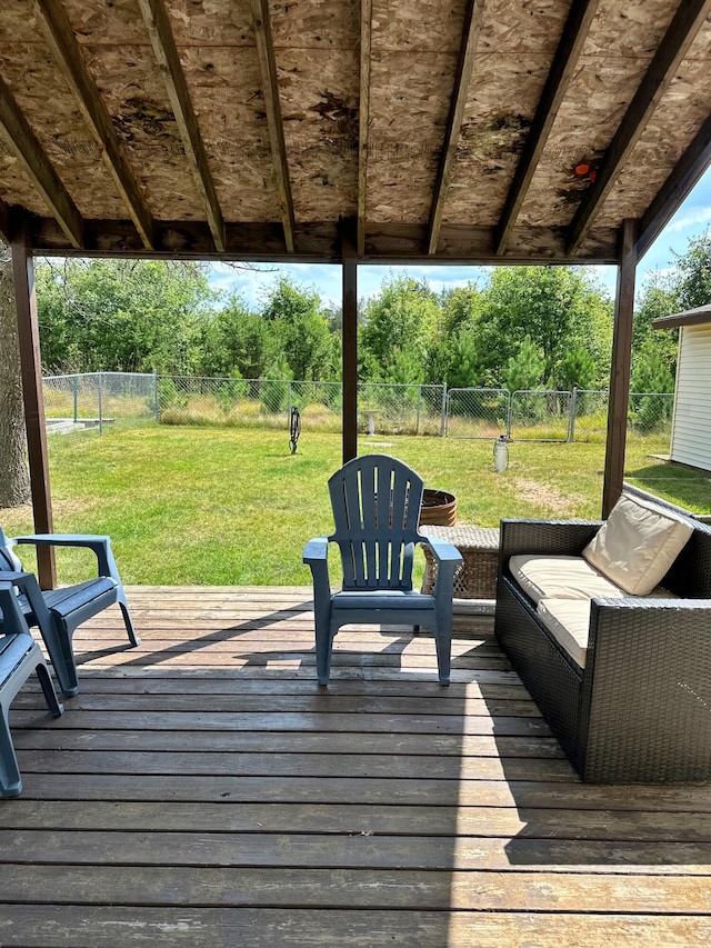 wooden terrace with a lawn