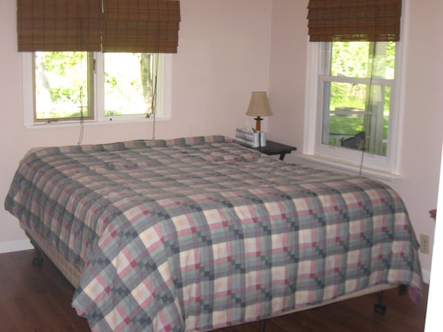 bedroom featuring dark hardwood / wood-style floors