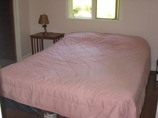 bedroom with wood-type flooring