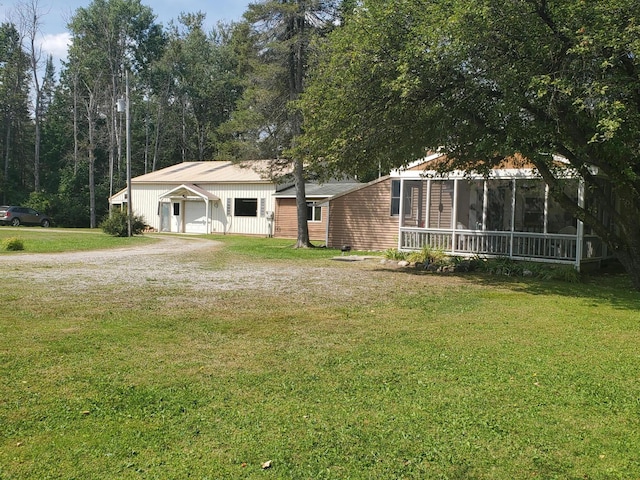 view of front facade with a garage and a front lawn