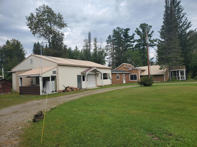 ranch-style home with a front yard and a garage