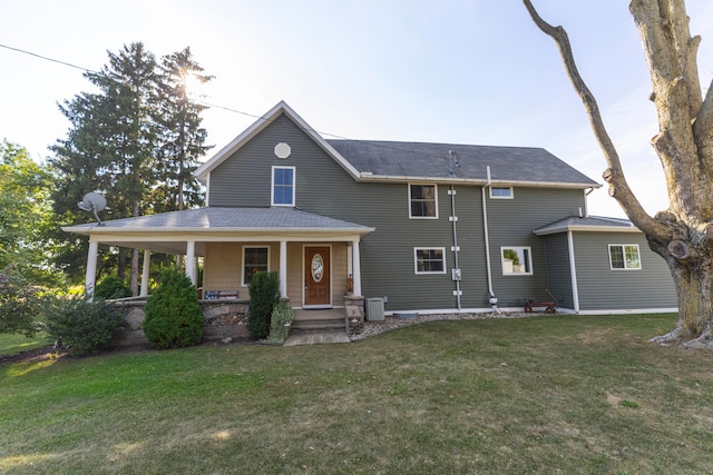 view of front of house with a porch and a front yard