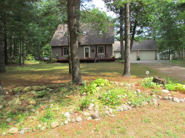 view of front of home featuring a garage and a front yard