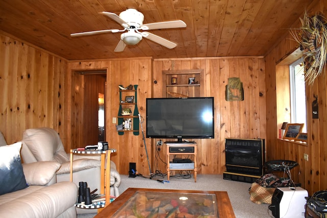 living room featuring ceiling fan, wood walls, carpet floors, and wooden ceiling