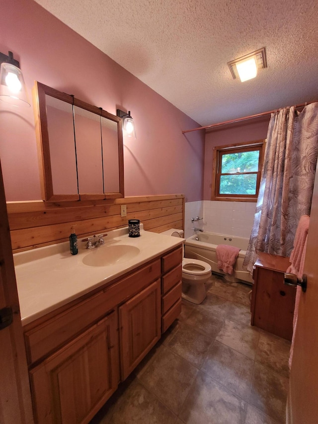 full bathroom with toilet, tile patterned flooring, vanity, separate shower and tub, and a textured ceiling