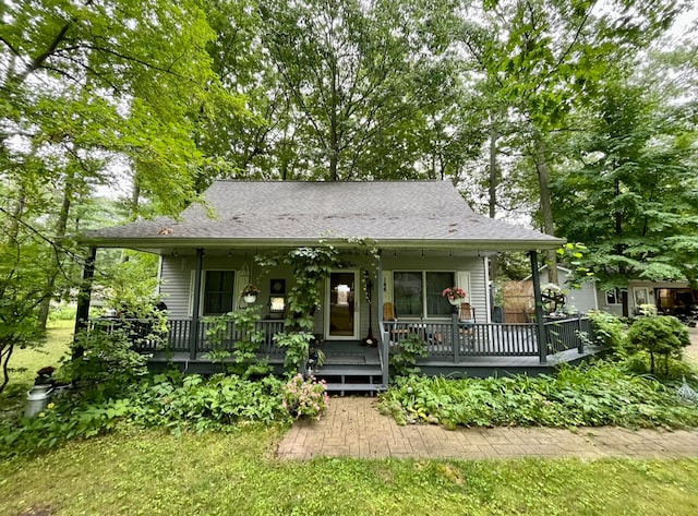 bungalow featuring a wooden deck