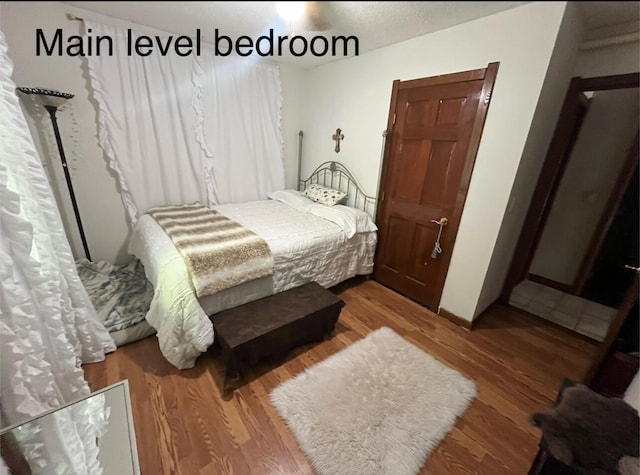 bedroom featuring wood-type flooring