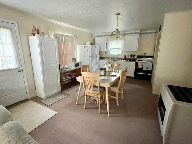 dining room with light colored carpet and an inviting chandelier