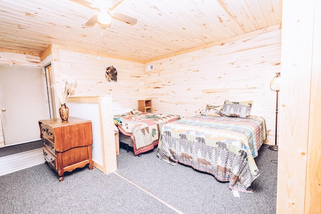 bedroom featuring wood ceiling, carpet, ceiling fan, and wood walls