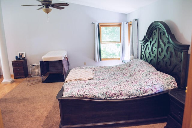 bedroom featuring carpet, lofted ceiling, and ceiling fan