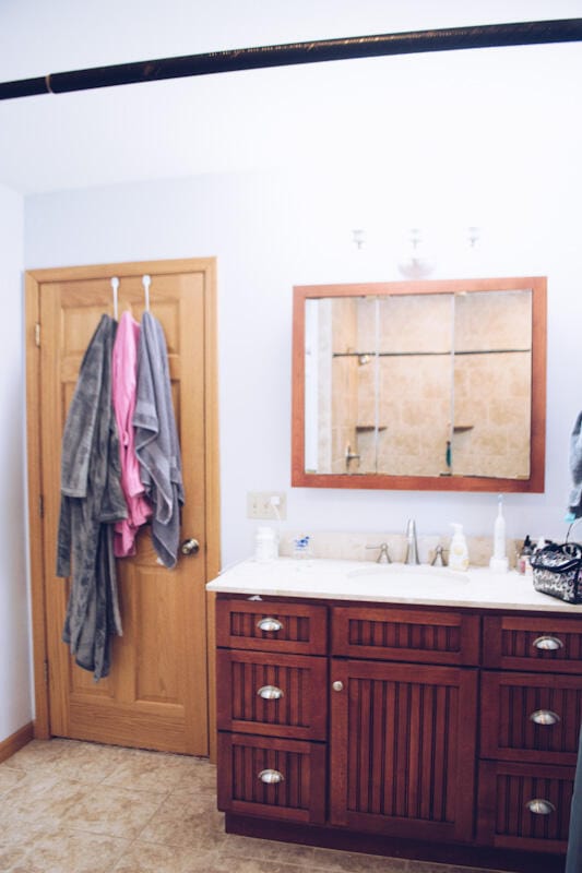 bathroom with tile patterned flooring and vanity