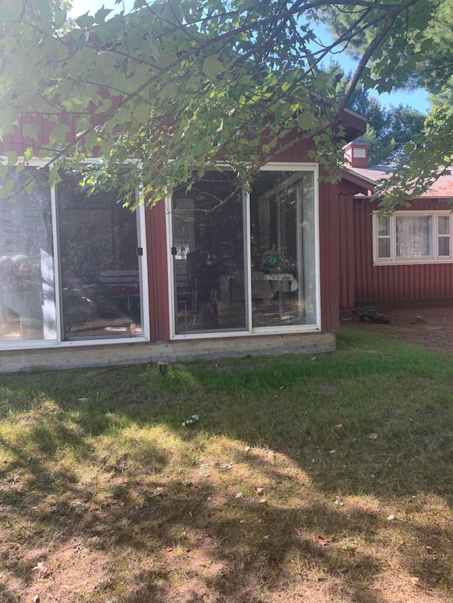 rear view of house with a lawn