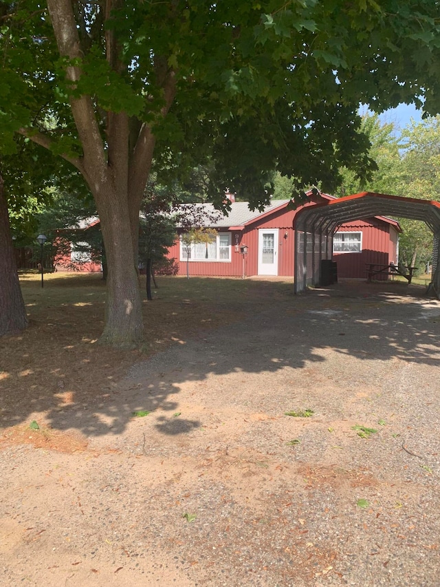 exterior space with a carport