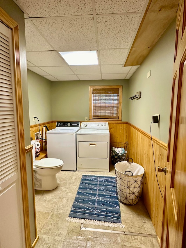 washroom featuring washing machine and dryer